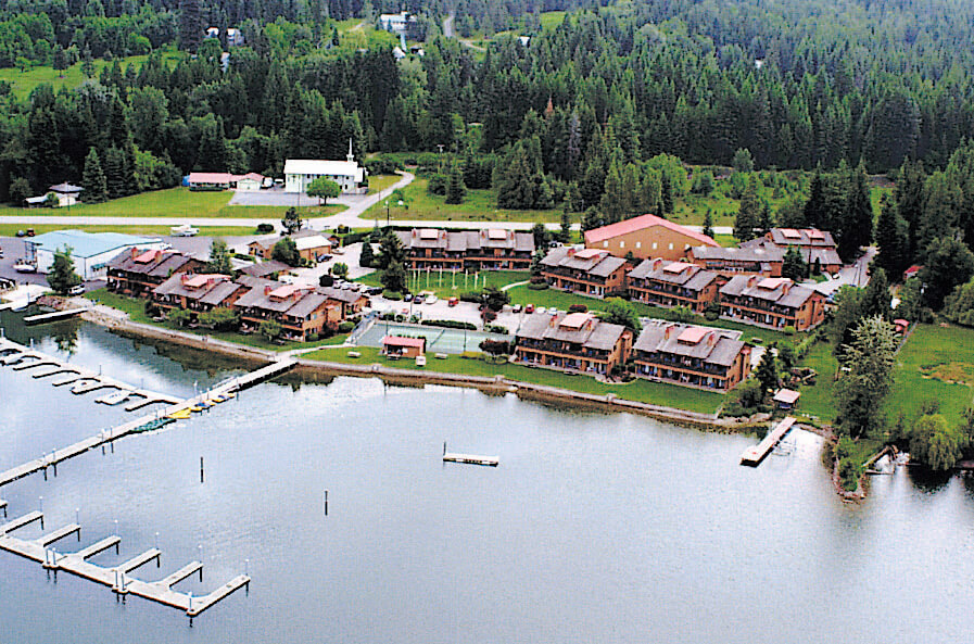 An exterior view of the resort next to a lake at VRI's Pend Oreille Shores Resort in Hope, Idaho.